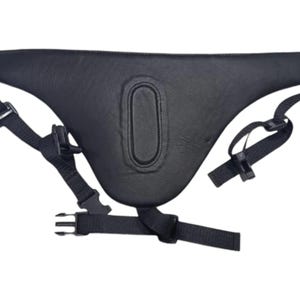May include: Black leather padded belt with adjustable straps and buckles. The belt has a large, oval-shaped pad in the center.