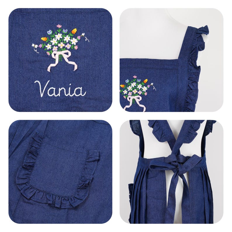 May include: A denim apron with a floral embroidery design and the name "Vania" in script. The apron features a ruffled pocket and straps, and a bow in the back. The embroidery includes white, yellow, blue, and pink flowers.