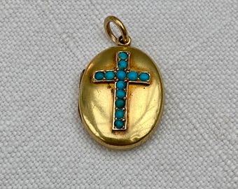 Victorian 18ct gold locket with turquoise cabochon set cross on front.