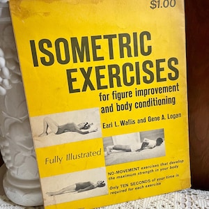 May include: A yellow paperback book titled Isometric Exercises for figure improvement and body conditioning by Earl L. Wallis and Gene A. Logan. The cover features black text and three black and white photographs of individuals performing exercises.