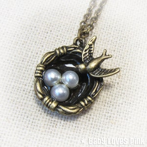 Ketting vogelnest met pareleieren (brons)