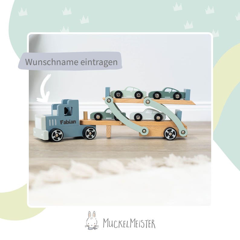 May include: A blue toy truck with the name "Fabian" on the side is carrying four smaller toy cars on a wooden platform. The truck has a wooden base and the cars are all light blue. The text "Wunschname eintragen" is visible in the top left corner of the image.