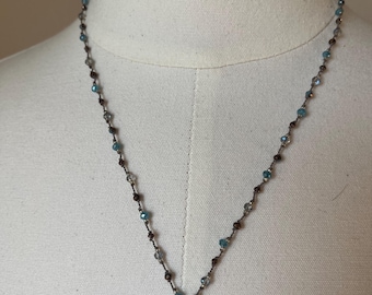 Chalcedony Gemstone in Sterling silver with a sterling flower accent and Brown, gray and blue crystals on a polymer nylon cord. 20 inches.