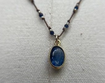 Beautiful Kyanite gem in gold plate necklace is hand knotted on a polymer nylon filament