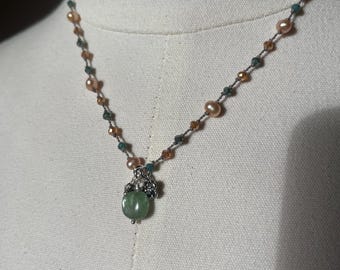 Green kyanite hand nodded necklace with freshwater pearls in a champagne, color and crystals