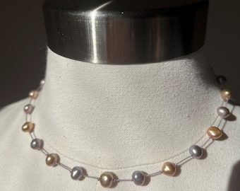 Champagne, pearl and gray pearl tin cups style hand nodded necklace on a fishing line. 16 inches