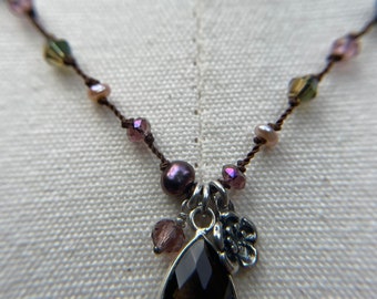 Faceted smoky Topaz in Sterling hand knotted necklace in pinks, greens, and browns.