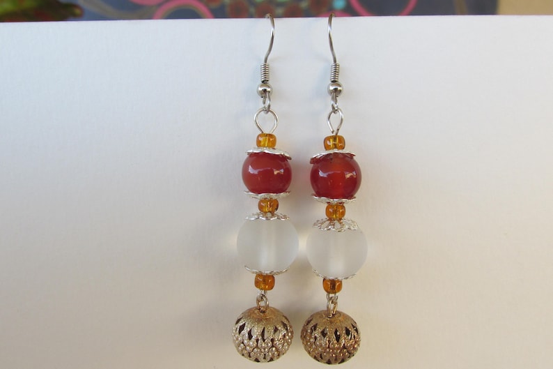 Orange and silver ball dangle earrings