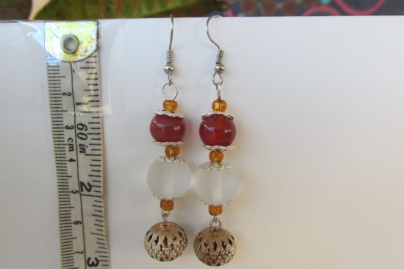 Orange and silver ball dangle earrings