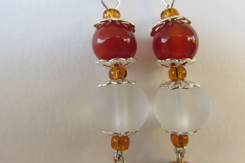 Orange and silver ball dangle earrings