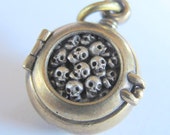 steampunk mourning locket SKULL LOCKET bronze with sterling silver skulls