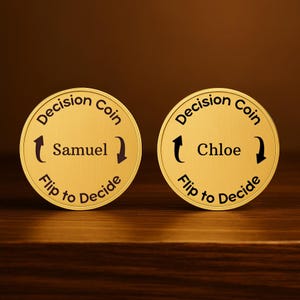 May include: Two gold-colored decision coins. One coin has the name "Samuel" and the other has "Chloe". Each coin has the text "Decision Coin" and "Flip to Decide" around the edges. Black arrows point to the names.
