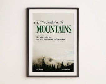 May include: A framed print with a green and white text overlay on a photo of a mountain range with trees. The text reads "Oh, I'm headed to the MOUNTAINS I'll be back in a week or two Don't you try to reach me 'cause I won't pick up for you" and is attributed to "Lizzy McAlpine" and "To The Mountains".