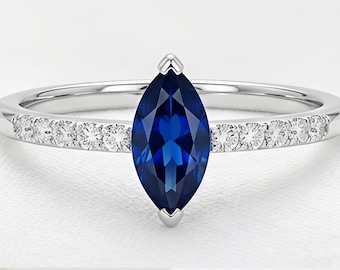 Anillo de oro blanco con zafiro azul talla marquesa y diamantes, diseño minimalista (piedra de nacimiento de septiembre).