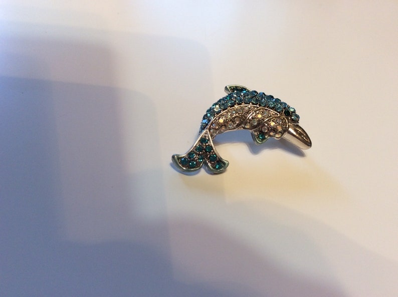 Rhinestone dolphin brooch