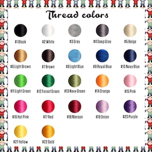 May include: A chart showing 22 different colors of embroidery floss. The floss is wound around spools and labeled with numbers 1 through 22. The colors include black, white, gray, beige, light brown, brown, light blue, royal blue, navy blue, light green, forest green, navy green, orange, pink, hot pink, red, maroon, onion, purple, yellow, and gold.