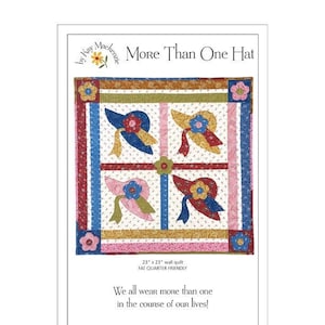May include: A wall quilt titled "More Than One Hat" featuring four hat designs in blue, red, yellow, and pink, each with a floral accent and ribbon. The quilt is 23 x 23 inches and includes the text "We all wear more than one in the course of our lives!"