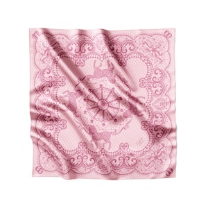 May include: A pink silk scarf with a pink and white design of a carousel with horses. The design is intricate and detailed, with a lace-like border.