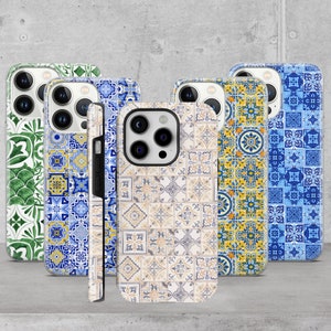 May include: Five different phone cases with a colorful geometric pattern. The cases are all clear and show the phone's camera lens. The patterns are inspired by traditional Portuguese tiles.