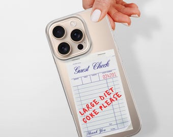 May include: A gold iPhone case with a clear back. The back of the case has a printed image of a restaurant guest check with the text "Large Diet Coke Please" written in red.