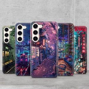 May include: Five different phone cases with a variety of Japanese-inspired designs. The cases feature images of a train station, a city street, a library, and a cherry blossom-filled street.