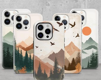 May include: Set of five phone cases with different mountain and forest designs. Each case features a white background with a watercolor-style landscape, including mountains, trees, and birds. The cases are all clear and show the phone's camera lens.