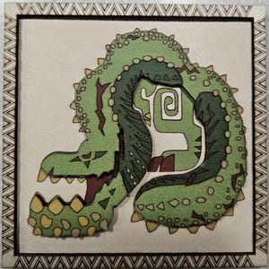 May include: A green and yellow wooden puzzle of a dinosaur with its mouth open. The puzzle is framed in a brown wooden frame with a decorative border.