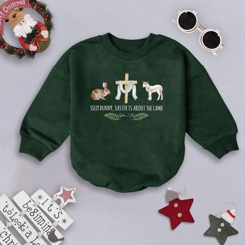 May include: A green long-sleeved sweatshirt with a white cross and a lamb, a rabbit, and the text "Silly Bunny, Easter is about the Lamb" with the scripture reference "John 1:29".