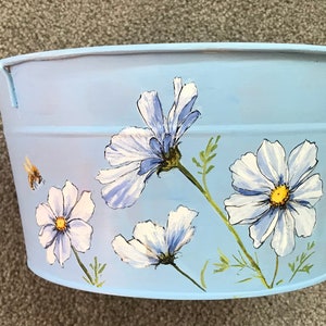 White Cosmos on a Blue Bucket
