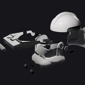 Pode incluir: Capacete branco decomposto com v&aacute;rios componentes separados, incluindo uma viseira, pe&ccedil;as das bochechas e uma se&ccedil;&atilde;o superior. O capacete parece ter um design futurista, possivelmente para cosplay ou uma fantasia. A imagem est&aacute; em um fundo escuro.