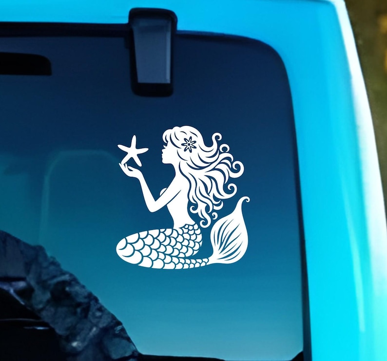 May include: A white silhouette of a mermaid holding a starfish. The mermaid has long flowing hair and a tail with scales. The mermaid is on a blue background.