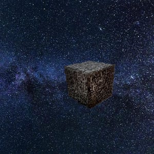 May include: A textured, dark gray cube floats in a starry night sky. The cube's surface is covered in intricate, geometric patterns. The background features a vibrant display of stars and nebulae, creating a cosmic scene.