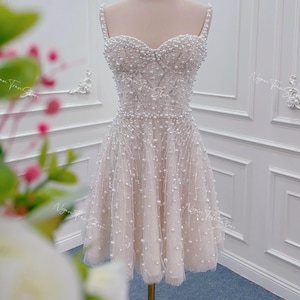 Perlenverziertes Tüllkleid: Elegantes wulstiges A-Linien-Hochzeitskleid