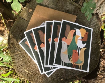 May include: A set of six greeting cards featuring a colorful illustration of birds on a dark background. The birds are stylized and have a retro feel. The cards are blank inside for writing a message.