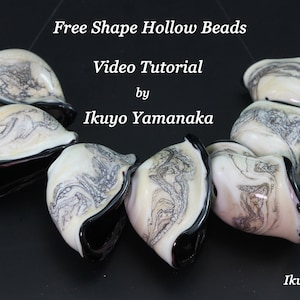 May include: Free Shape Hollow Beads with a video tutorial by Ikuyo Yamanaka. The beads are white with gray marbling and black rims. The background is black, and the text is white.