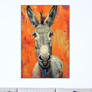 May include: A striking painting of a donkey set against a vivid orange backdrop. The donkey's face is rendered in shades of grey, white, and blue, with prominent ears and an inquisitive expression. The artwork employs bold brushstrokes, resulting in a textured and dynamic appearance.