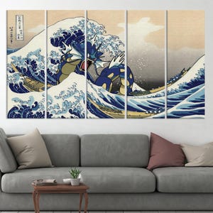 May include: A multi-panel canvas print featuring a blue and yellow wave with a blue and green Pokemon character emerging from the wave. The wave is reminiscent of the Great Wave off Kanagawa by Hokusai.