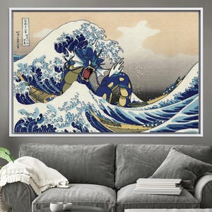 May include: A blue and yellow Pokemon, resembling a dragon, emerges from a large, crashing wave in a Japanese-style art print. The wave is depicted in shades of blue and white, with a background of light orange and gray. The text in the upper left corner reads "神奈川沖浪裏" in Japanese.