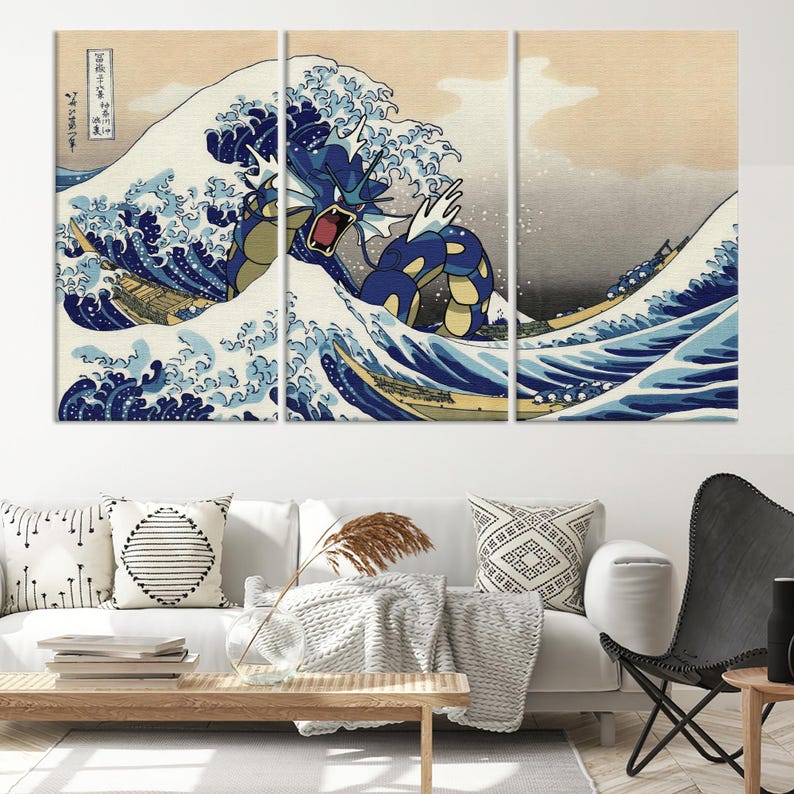 May include: A three-panel canvas print featuring a blue and yellow Pokemon character emerging from a large wave, inspired by the famous Japanese woodblock print "The Great Wave off Kanagawa".