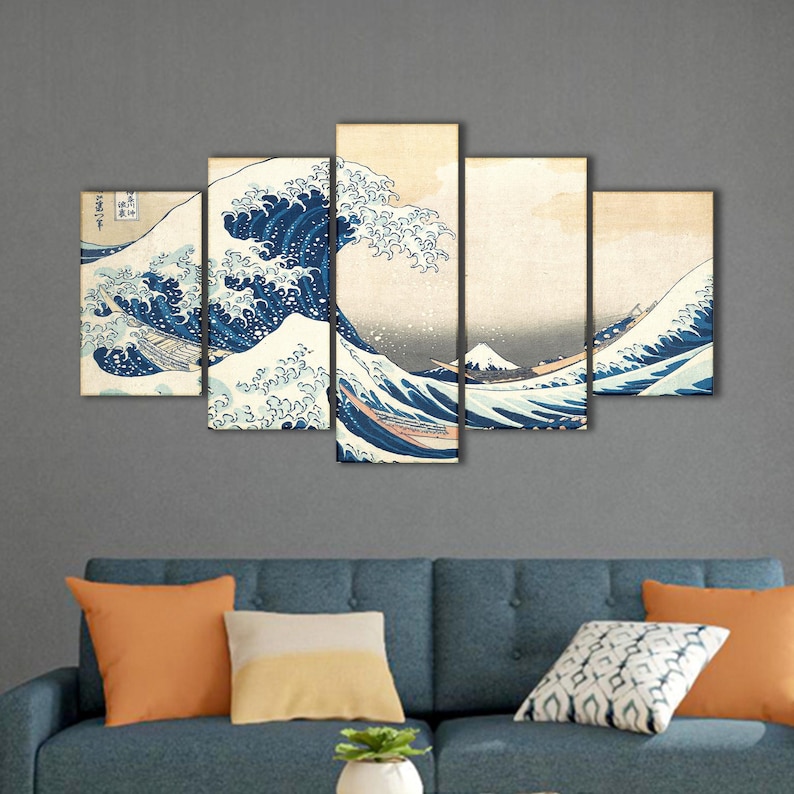 May include: Five-panel wall art featuring a classic Japanese woodblock print of a large ocean wave. The artwork depicts a dynamic scene with a large wave in shades of blue and white, with boats and a mountain in the background.