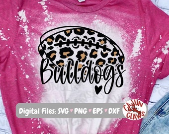 May include: Pink and white tie-dye t-shirt featuring a football with a leopard print design. The word "Bulldogs" is written in a script font below the football. The shirt also includes the text "Digital Files: SVG, PNG, EPS, DXF".