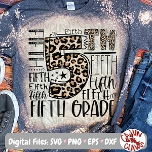 May include: A gray t-shirt with a bleach-splattered design featuring a leopard print number five and the text "Fifth Grade".