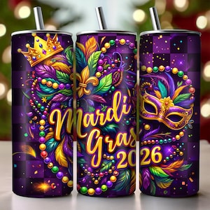 May include: Three purple insulated tumblers with Mardi Gras designs. Each tumbler features a different design, including a gold crown, fleur-de-lis, and a mask, with the words "Mardi Gras 2026" in gold.