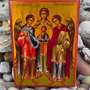 May include: A hand-painted wooden icon depicting the three archangels Michael, Gabriel, and Raphael. The icon features a gold background with a red border and the text "Η αγιαζω" and "ΣΗ ΑΓΓΕΛΟΙ" in Greek.