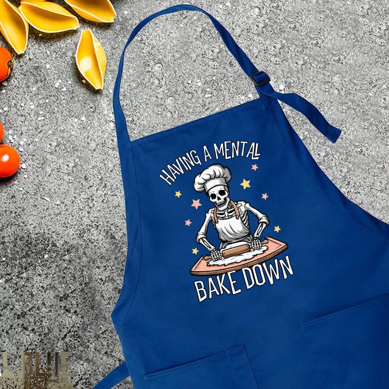 a blue apron with a skeleton on it