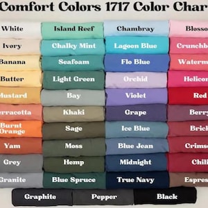 a group of different colored sheets and pillows
