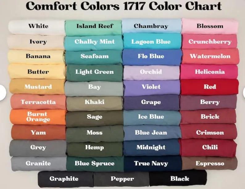 a group of different colored sheets and pillows