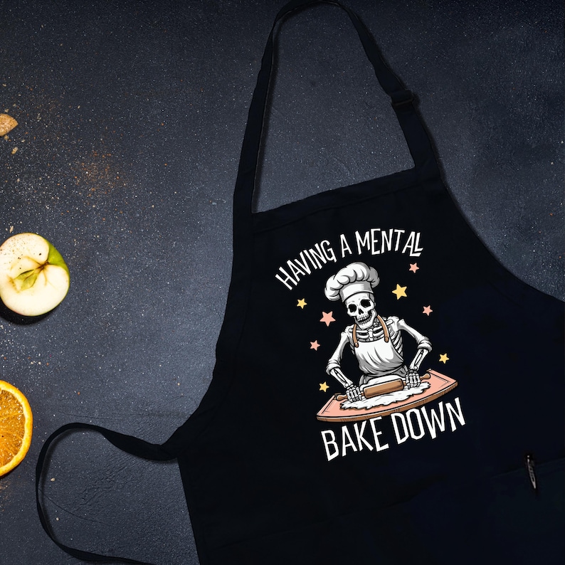 a black apron with a skeleton on it