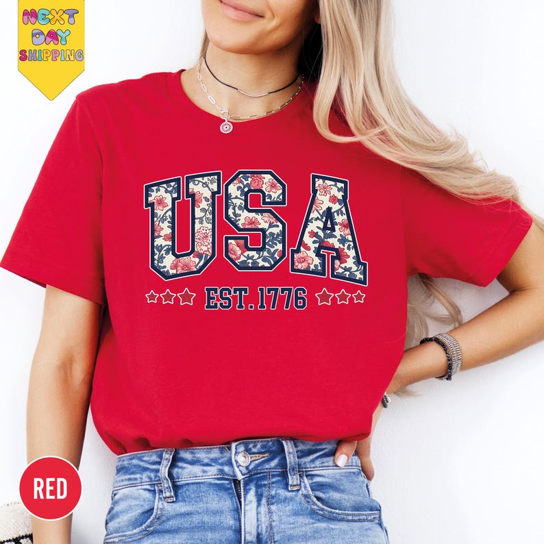 a woman wearing a red usa t - shirt