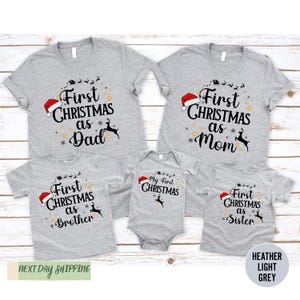 a family of three wearing matching christmas shirts